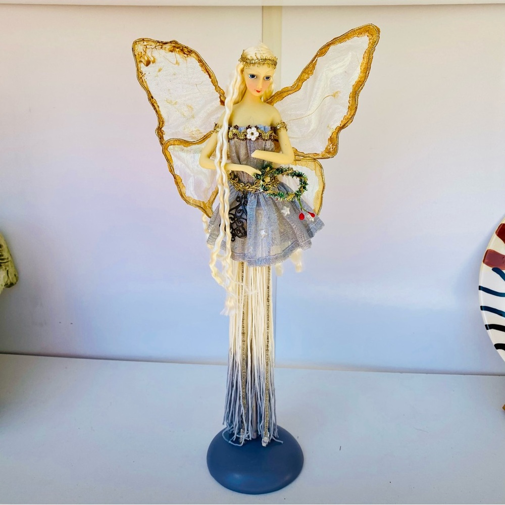Elegant Fairy Figurine with Gold and White Wings